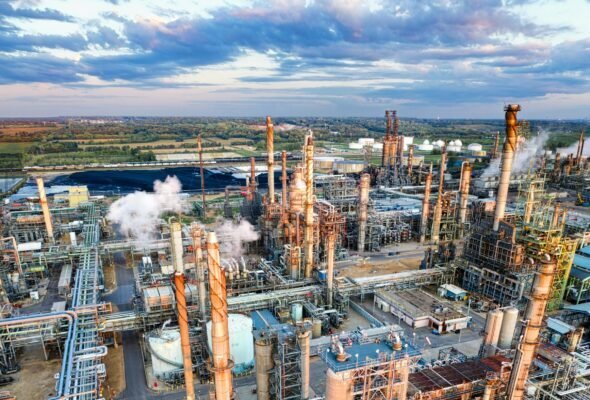 Stunning aerial shot of a large oil refinery in Rosemount, MN during sunset, showcasing industrial complexity.
